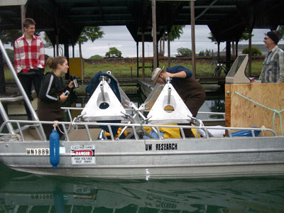 Evan, Erika, Levi, and Bill (left to right) driving tripods out to the flats for deployment.