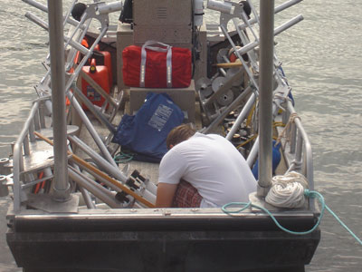 Levi tying down tripod parts for transport to the flats.