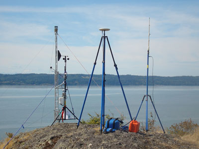 GPS base station and RTK transmitter on top of Craft Island with the flats at high tide visible in the background. Jim Thomson and Chris Chickadel’s weather station and tower are just behind the base station.