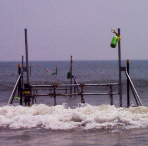 A SPUVT frame near the shoreline at low tide.